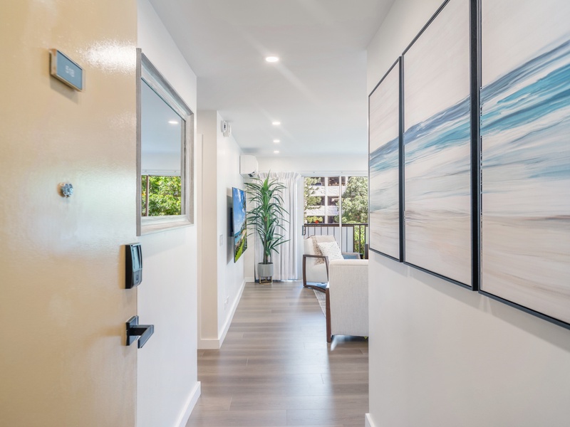 Step inside to a clean, light-filled entry that opens straight into the gathering spaces—an inviting start to your at Kuhio at Waikiki.