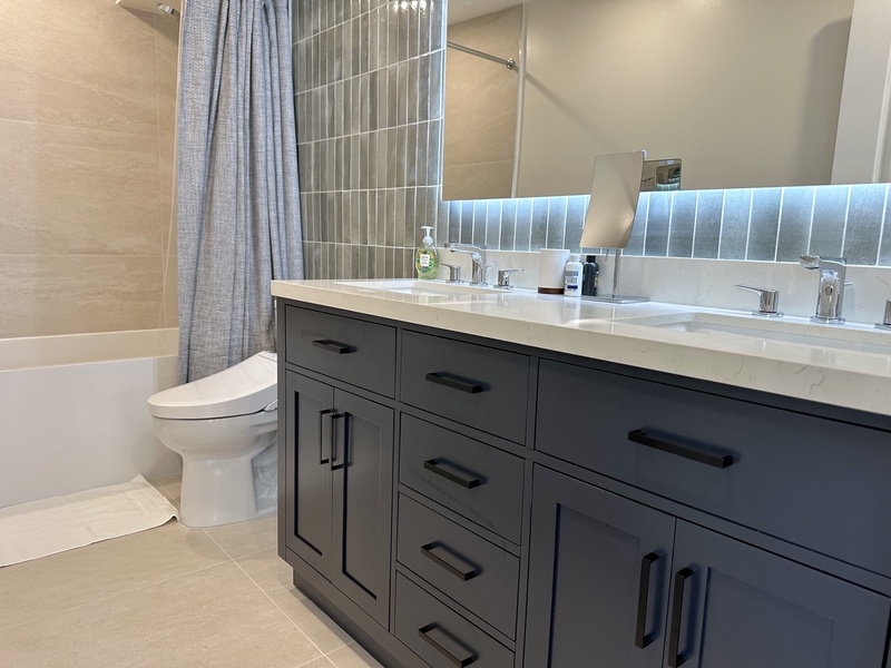 Bathroom with Toto Toilet Bidet LED Mirror Double Sink and Soaki