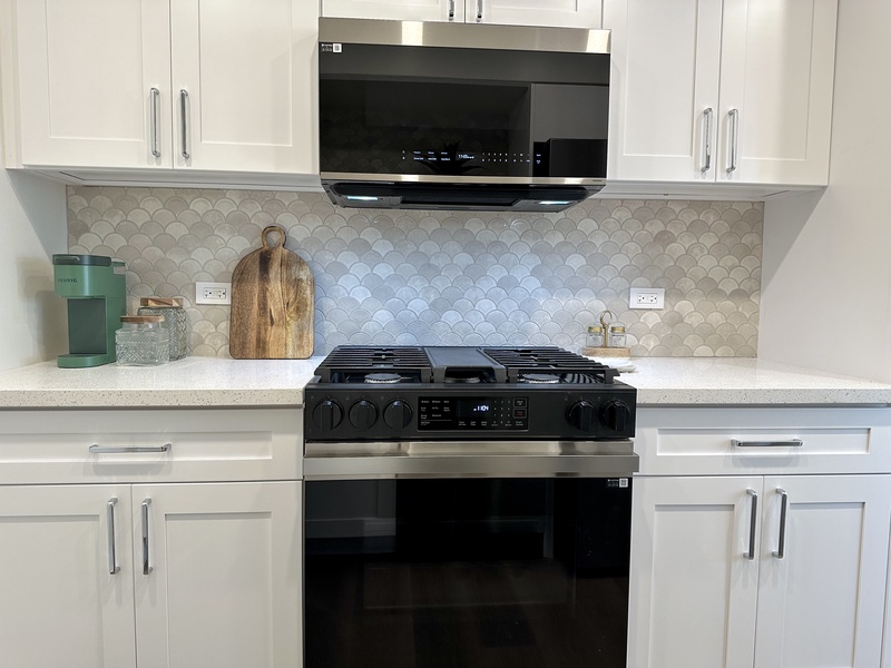 Kitchen with refrigerator, ice maker, dishwasher, garbage dispos