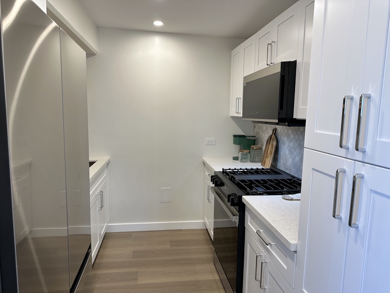 Kitchen with refrigerator, ice maker, dishwasher, garbage dispos