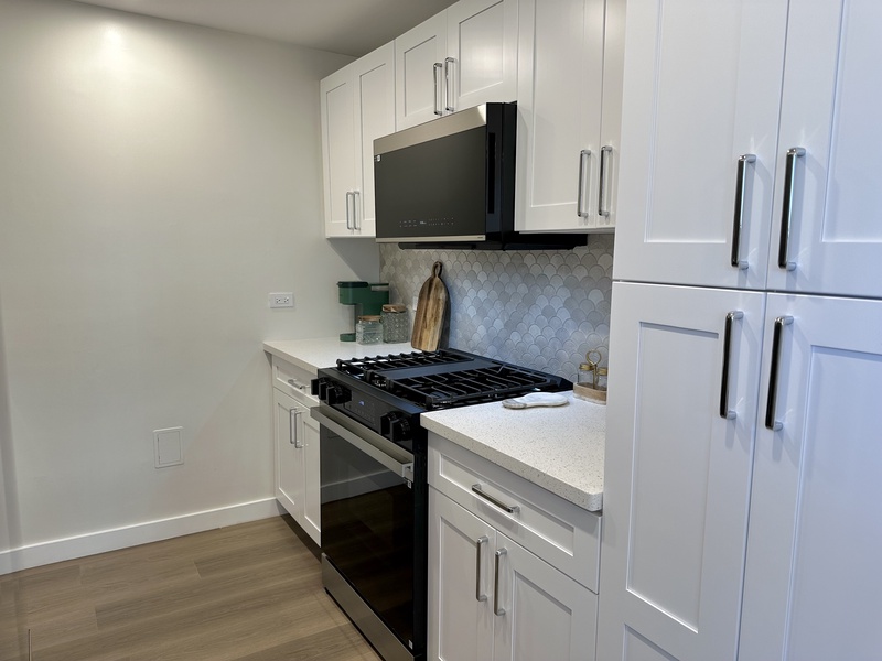 Kitchen with refrigerator, ice maker, dishwasher, garbage dispos