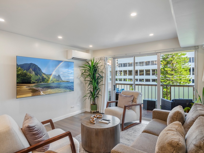 Welcome to your Waikiki retreat; an inviting living room with a sofa sleeper, smart TV, and open lanai where indoor comfort meets island breeze.