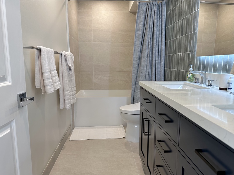 Bathroom with soaking tub toto toilet bidet and LED mirror