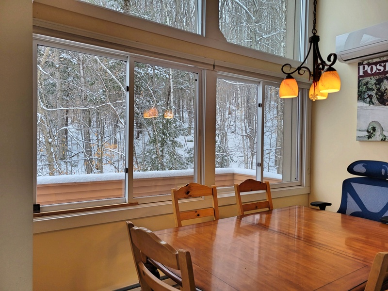 Dining area enjoying wooded view