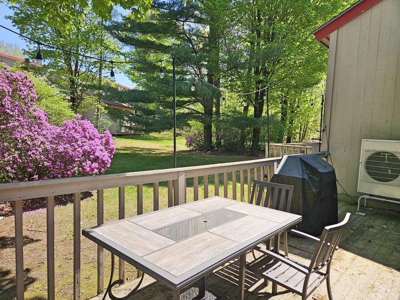Deck area with grill and view of back yard area