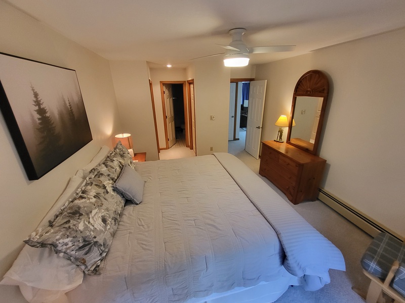 Primary Bedroom w/ King Size Bed and Private Bathroom