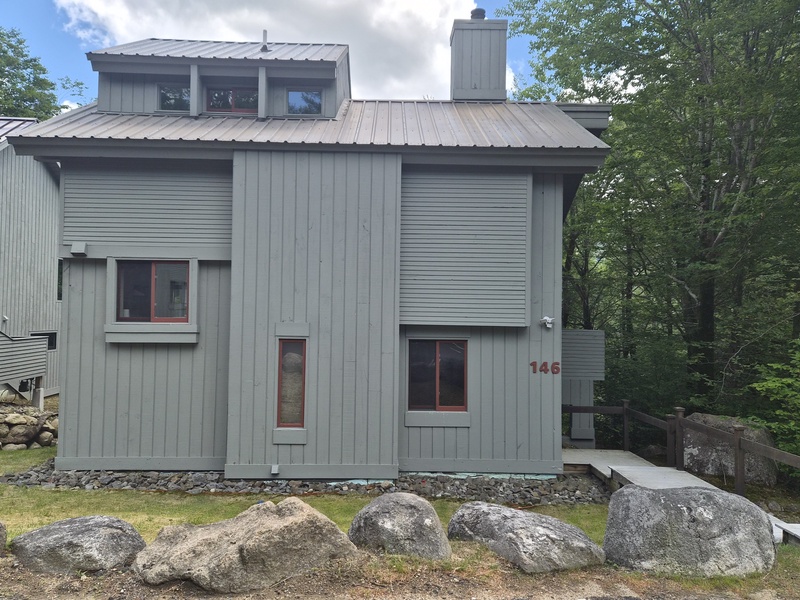 Clearbrook 146, a freestanding home with 5 easy steps down from the parking area to the entry door.