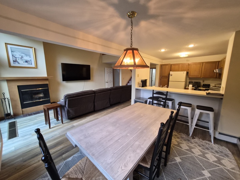 The Dining Table comfortably seats 6 to 8, with a Breakfast Bar that offers seating for 3 to 4 more.