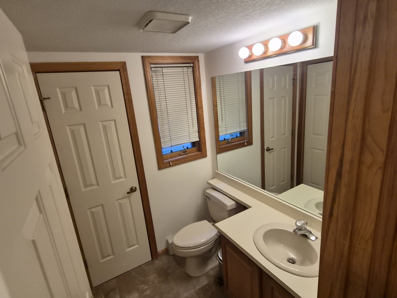 Enter the unit, turn left and you'll find this 1/2 bath that services the main floor next to a full laundry room.