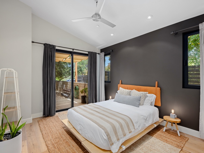 Guest bedroom with front patio access.