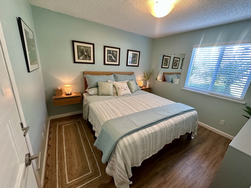 The second bedroom has a queen bed.