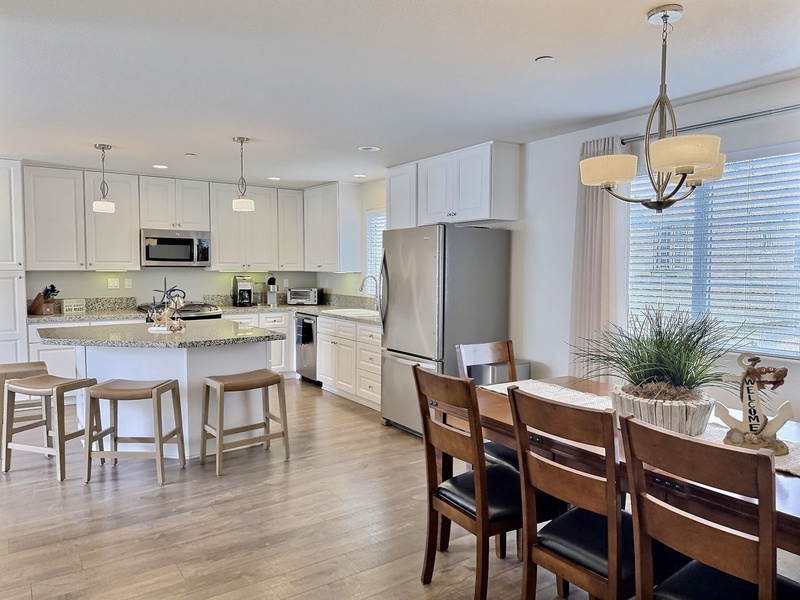 The nearby dining area offers plenty of seating for the whole crew — perfect for beachside meals and making lasting memories together.