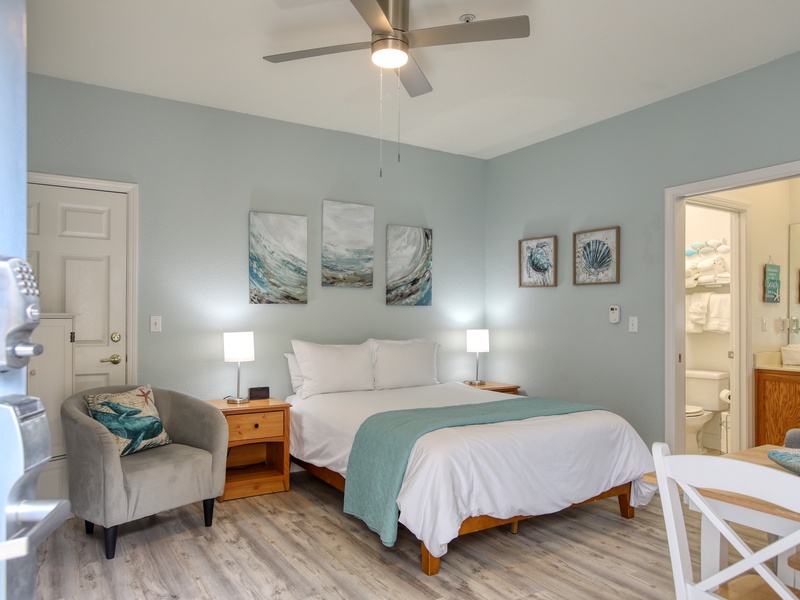 Welcome to Coastal Gem, Unit 505! This cozy downstairs studio features a comfy queen bed and a compact kitchenette—perfect for your seaside escape. 