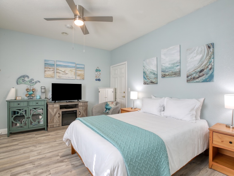 Cozy queen bed. Warm fireplace glow. Smart TV and sunny beach vibes. Perfect hideaway for couples or solo traveler.