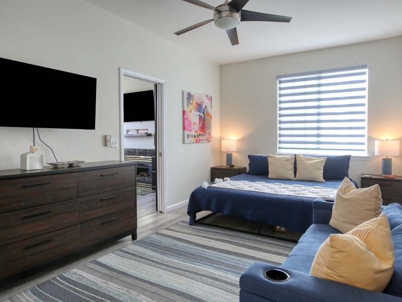 The bedroom features a comfy king bed for a restful night after beach adventures, plus a queen sleeper sofa for extra sleeping space.