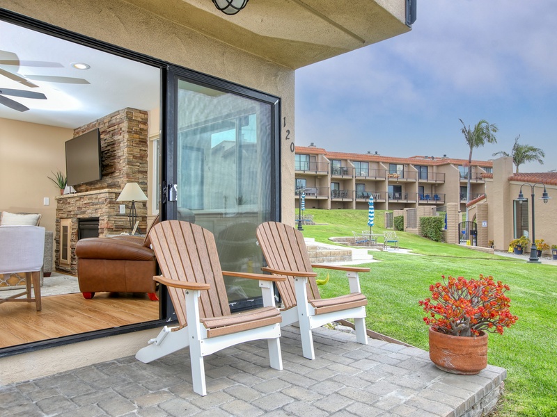 Relax on the Adirondack chairs on the back patio and enjoy views of the lush grassy green — perfect for sipping your morning coffee or unwinding with a sunset in hand.