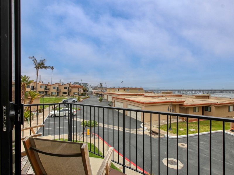 The master ensuite opens to a private balcony overlooking Pismo Shores with Pacific Ocean views.