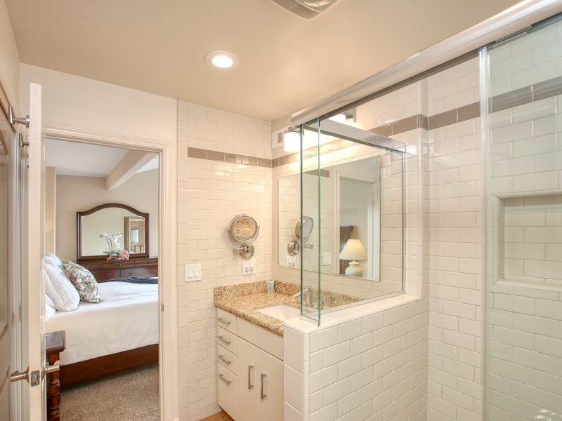 The master ensuite includes a walk-in shower and is stocked with luxurious white towels and premium body soaps.