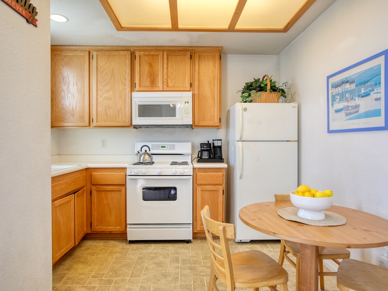 The fully equipped kitchen has a refrigerator, stove and oven, microwave, k-cup coffee maker, and dish ware—everything you need to whip up meals or enjoy a fresh cup of coffee before heading to the beach. 