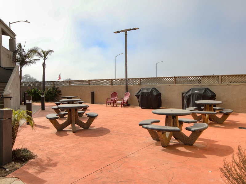 Fire up the flavor! Two gas grills, plenty of seating & coastal vibes for the ultimate BBQ hangout.
