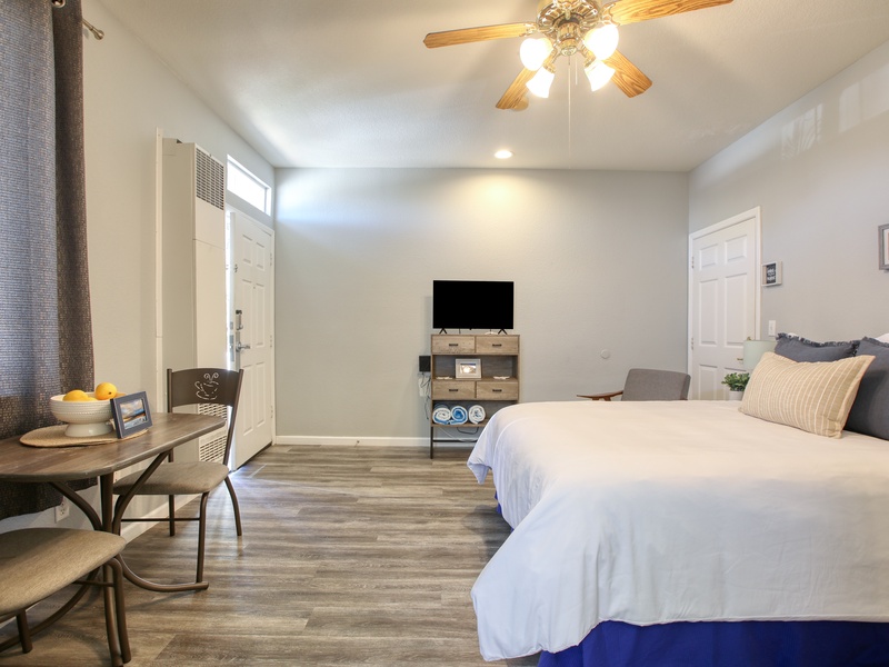 Chill, relax, repeat! Salty Studio has a queen bed, TV, ceiling fan, beach towels, and a sweet little dining nook for two. Perfect beach stay!