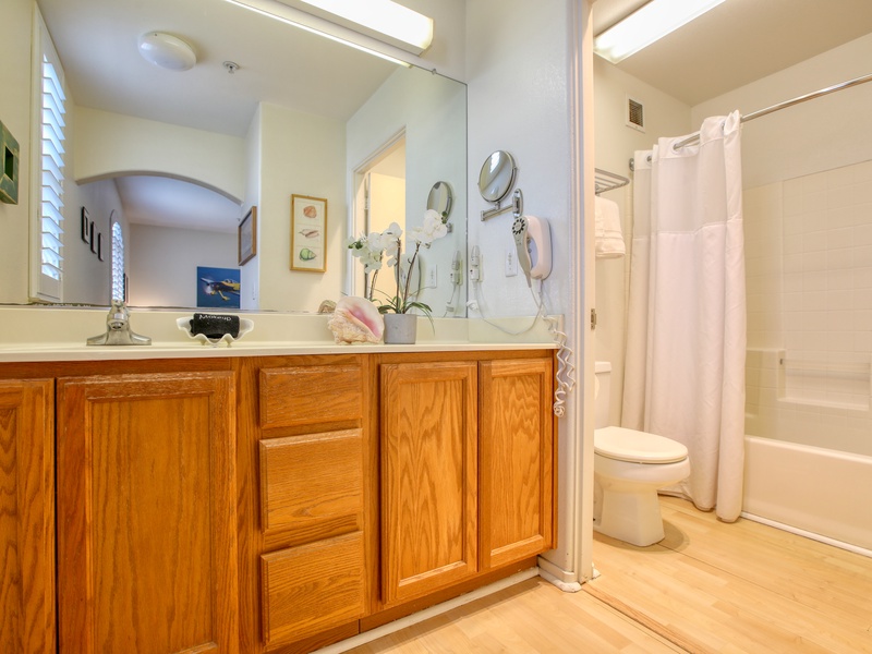 A large vanity and tub shower combo for those sandy days after the beach! 