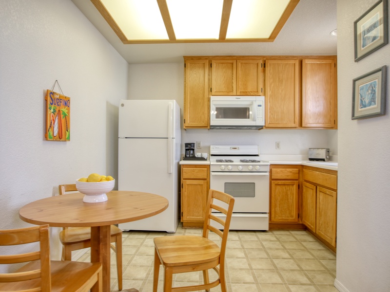 A cozy dining nook and ample storage for all of your kitchen needs! 
