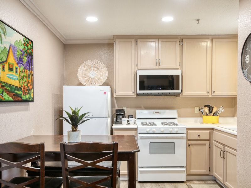From the morning coffee to a family feast, enjoy a modern space featuring a full-sized refrigerator, stove, oven, and microwave.