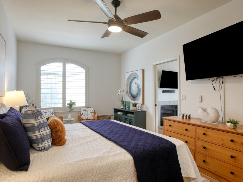 The bright, airy bedroom features a king bed, SmartTV, and a dresser for all your clothes and essentials.