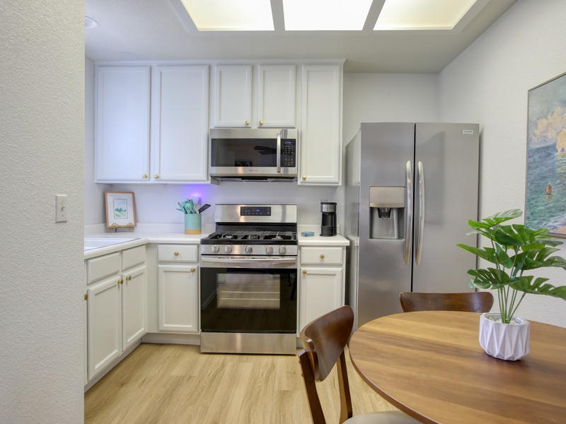 The fully equipped kitchen has a refrigerator, stove and oven, microwave, k-cup coffee maker, and dish ware—everything you need to whip up meals or enjoy a fresh cup of coffee before heading to the beach. 