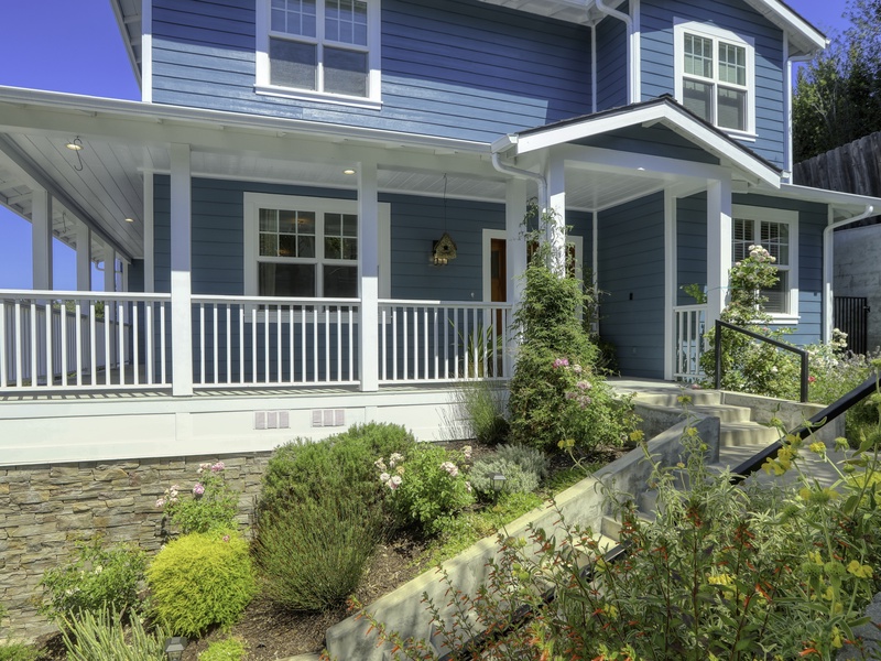 Approach Paseo del Sol via a charming walkway, beautifully adorned with native plants and the inviting fragrance of roses.