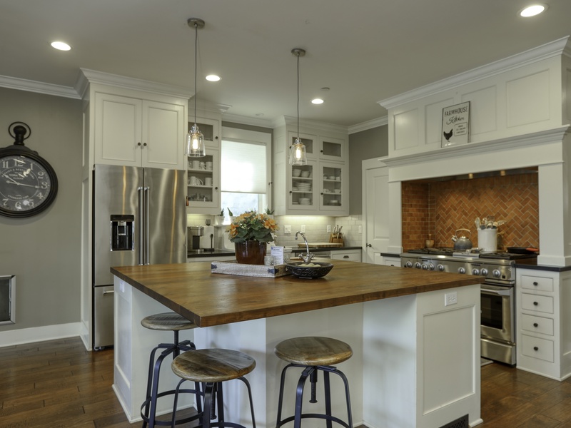 A magnificent, chef-ready kitchen that is beautifully appointed and fully stocked for all your culinary needs. The expansive center island and integrated breakfast bar provide exceptional space for both preparing meals and gathering