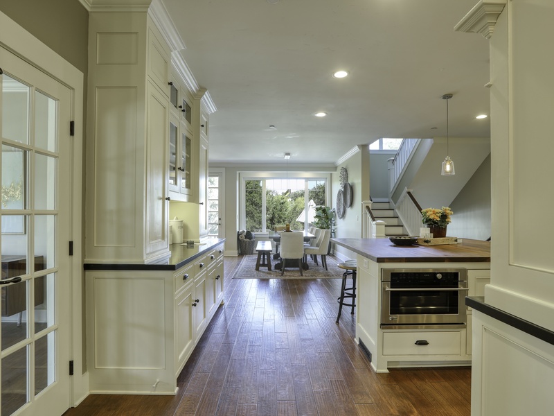 The foyer leads directly into the home's main central hub: the great room, kitchen, and the fabulous outdoor entertaining deck. 