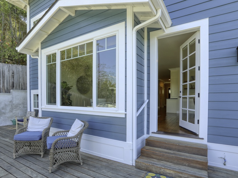 Step directly onto the patio deck from the dining room, where a complete outdoor living experience awaits. (Note: There are three steps down to the deck area.) This space offers ample outdoor seating areas, shaded dining with an umbrella, and a gas BBQ.