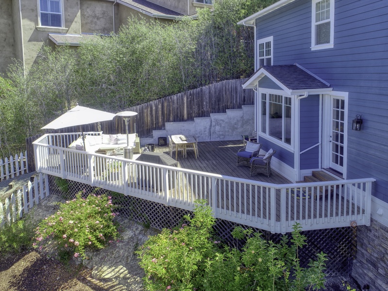 Enjoy a complete outdoor living experience on the deck, accessible via the dining room. Amenities include a large seating area, shaded dining, and a gas barbecue.

Fire Safety: As the home is in a high-risk area with a wood deck, smoking is strictly forbidden within 20 feet of the property.